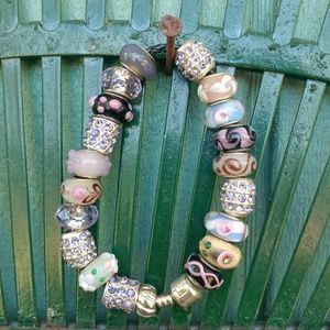 Beaded charm bracelet with silver accents.